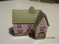 Pink cottage front and side view