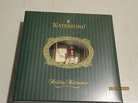 Closed Waterford Holiday Heirlooms box with window showing one nutcracker ornament