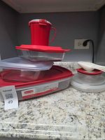 Full assortment stacked showing various containers, lids and pitcher