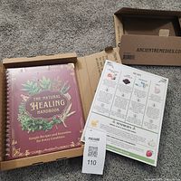 Book and insert inside open shipping box