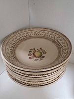 Stack of large plates showing pattern and condition