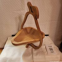 Basket displayed open showing 3-D form and handle