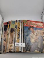 Stack of Cheyenne Dell comics in sleeves, top copy priced 15¢