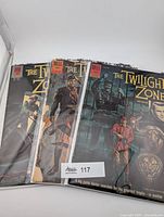 Three bagged Twilight Zone comics stacked