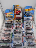 Front view of all 20 sealed blister-pack diecast vehicles