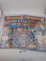 Front view of Worlds Finest Comics issues 259 and 263 inside top loaders
