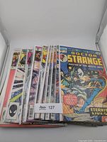 Stack of bagged Doctor Strange comic books fronted by 'Eternity Lives!' issue