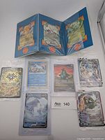 All cards laid out including fold-out with Venusaur V and Blastoise V plus six individual sealed cards