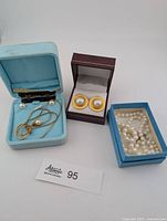 Lot overview showing all jewelry pieces in boxes