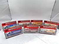 Front view of all seven boxed transporters