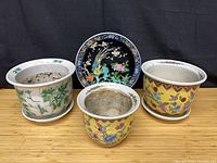 front view of three planters and decorative plate