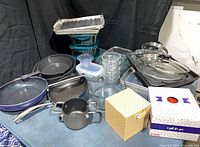 Group shot of all cookware, glass containers, tumblers and gift boxes