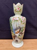 Full view of mint green opaline glass vase showing hand-painted landscape and floral neck