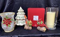 Full lot showing tree jar, boxed snowman figure, two resin cardinals, frosted votive, glass hurricane with candle