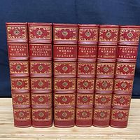 Spine view of six matching red leather poetical works volumes