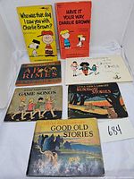 All seven books laid out, covers visible