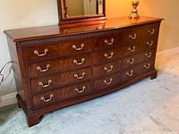 Full view of dresser front and top showing 12 drawers and brass pulls