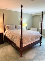 Full view of assembled queen four-poster walnut bed