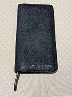 Front view closed showing BURBERRY logo and texture