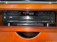 Front view of Sony CDP-C315 5-disc CD changer powered on