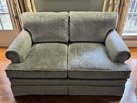 Front view of silver crushed velvet loveseat