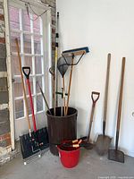 All long-handled tools, shovels, rake, broom, pole, containers