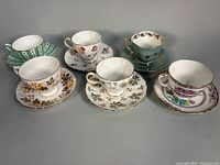 Group shot of six teacup and saucer sets