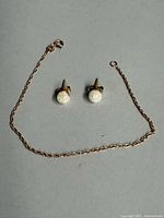 Overall view of bracelet and both earrings