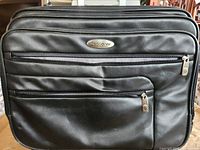 Front view showing Samsonite logo and exterior pockets