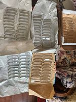 Stacks of colonial cut crystal prisms wrapped in paper