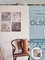 Box front showing four-piece mirror set and Candice Olson branding