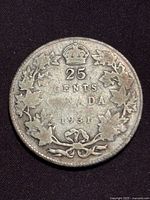 Reverse view showing 25 CENTS CANADA 1931 within maple leaf wreath and crown