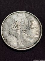 Reverse showing caribou, 25 CENTS and 1954 date