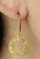 earring worn on ear showing size and design