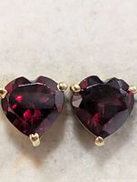 Front view of both garnet heart studs