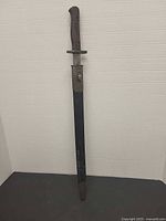 Full view of bayonet in scabbard