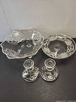 All four glass pieces: footed bowl, low bowl, two candlesticks