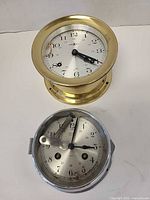 Brass and chrome clocks front view