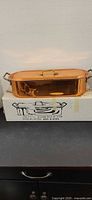 Closed copper fish poacher on original box