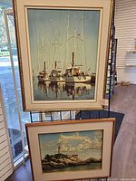 Both framed paintings displayed together for size and frame style reference