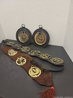 Overview of all leather straps and plaques with brass ornaments