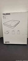 Front of sealed IKEA Tillreda box showing product sketch