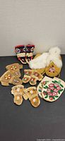 All items overview – mukluks, moccasins, three mitten pairs and single beaded mitten/pouch