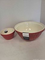 Both Mason Cash red bowls side by side showing size difference