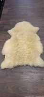 Top view of sheepskin showing fleece side and size
