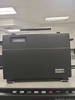 Front of closed radio showing Sony badge and carry handle