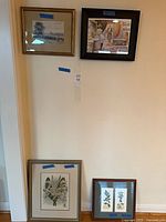 Group shot of all four framed artworks on wall