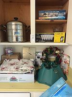 Overview showing steamer pot, LED bulb pack, Seiko clock, wreath, tree stand, linens and glass bowl