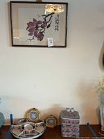 Overview showing framed art, serving tray set, cameo plaques, stacking canister, partial vases