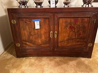 Front view of buffet showing painted doors and brass hardware